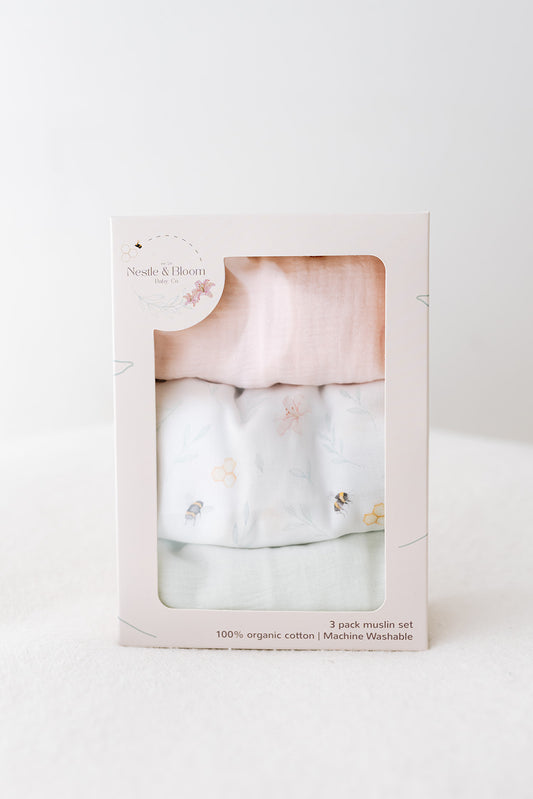 Organic baby muslin set in bespoke gift boxes with floral bee design on a white background